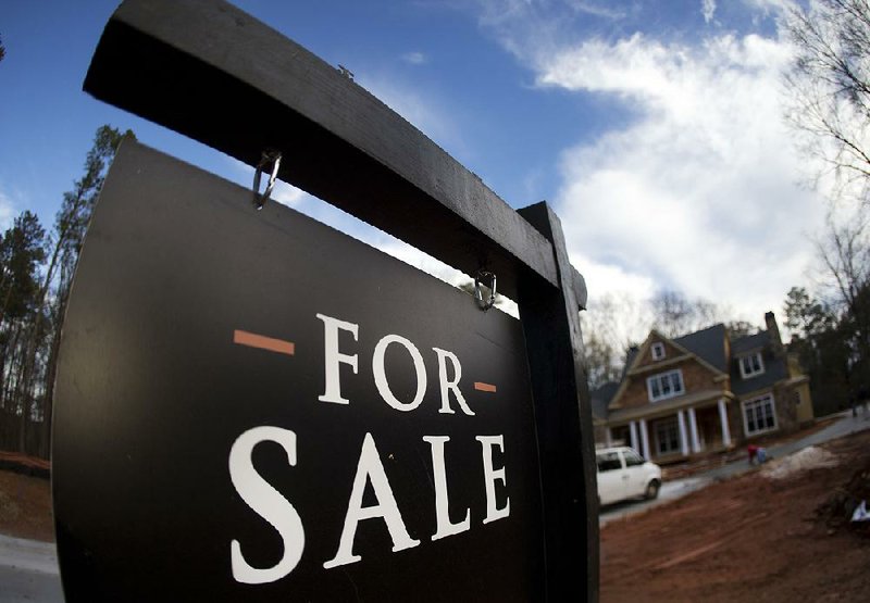 A sign marks a new house for sale in Roswell, Ga. U.S. home prices rose in July, even as sales have slowed. 