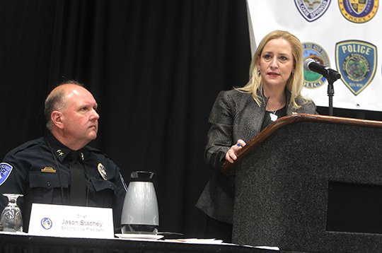 The Sentinel-Record/Richard Rasmussen MORNING ADDRESS: Arkansas Attorney General Leslie Rutledge, right, kicks off the annual meeting of the Arkansas Association of Chiefs of Police, which is celebrating its 50th anniversary, Tuesday morning as Hot Springs Police Chief Jason Stachey listens at the Hot Springs Convention Center. The convention is scheduled to run through Thursday.