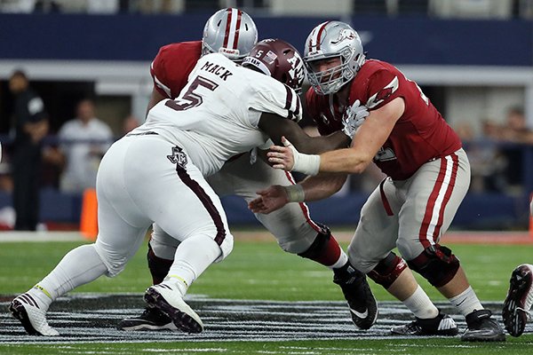 Texas A&M defensive lineman Daylon Mack (5) and Arkansas offensive lineman Frank Ragnow (72) face off during an NCAA college football game, Saturday, Sept. 23, 2017, in Arlington, Texas. (AP Photo/Tony Gutierrez)

