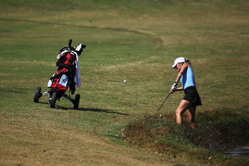 Sydney Staton of Fort Smith Southside hits onto the fairway on the 15th hole during the Class 7A girls golf state tournament Wednesday at Centennial Valley Golf and Country Club in Conway. Staton finished runner-up to Conway’s Casey Ott, shooting a 78 Wednesday for a two-day score of 148. 