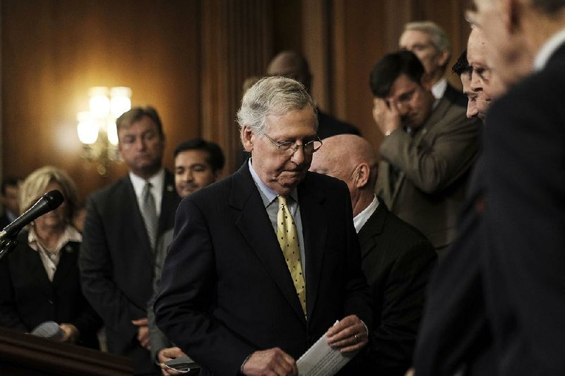 Senate Majority Leader Mitch McConnell leaves a news conference about tax policy Wednesday on Capitol Hill. 