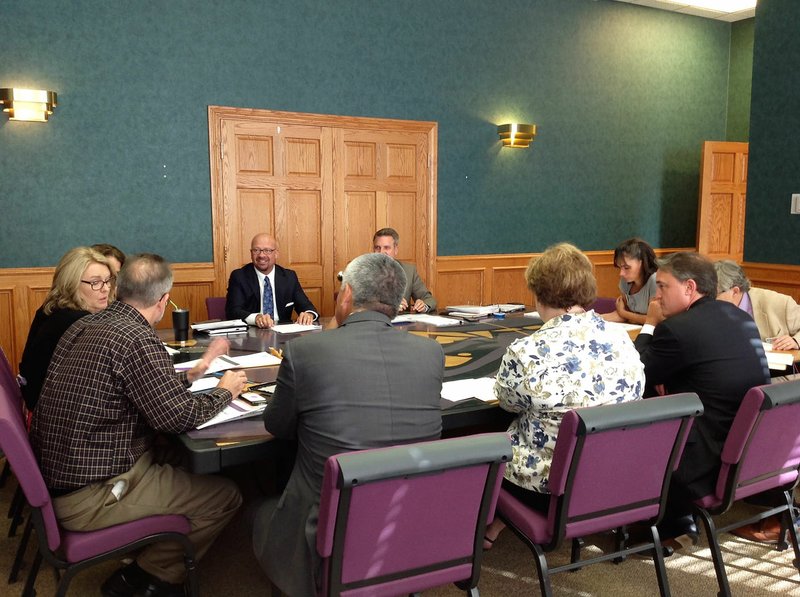 NWA Democrat-Gazette/DAVE PEROZEK The Fayetteville School Board meets with district administrators in a work session before its regular meeting Thursday.