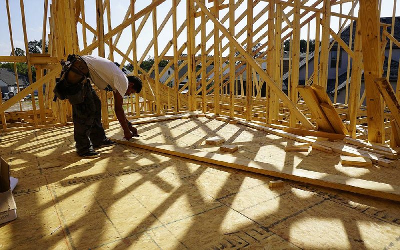 Freddy Cruz frames a house last week in Fort Worth in northern Texas, where homebuilders are expecting hurricane recovery efforts to prolong an existing labor shortage. 