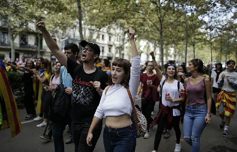 Students march Thursday in Barcelona to protest the central government’s crackdown on Sunday’s planned independence referendum in Catalonia. 
