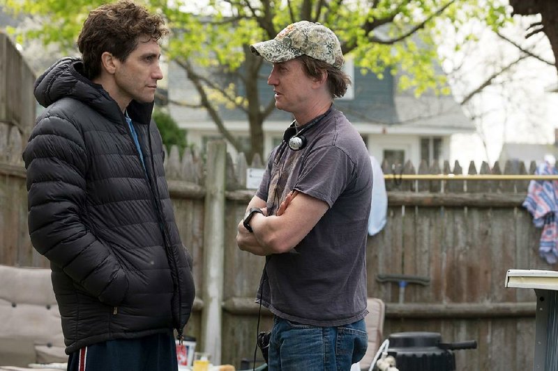 Jake Gyllenhaal takes notes from director David Gordon Green on the set of Stronger.

