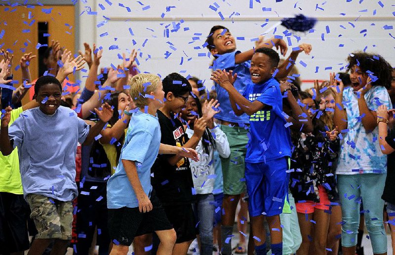 Don R. Roberts Elementary School students celebrate after the Little Rock school was named a National Blue Ribbon School on Thursday. Roberts was one of only three schools in the state and one of 342 schools in the nation to win the honor. College Station Elementary in the Pulaski County Special School District and John P. Woods Elementary in Fort Smith were the other state schools. 