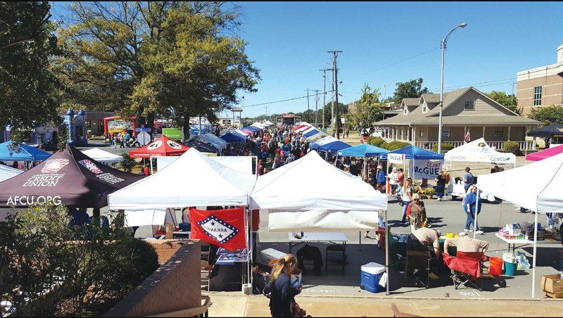 Children and adults participate in the games and shop the vendors’ booths at last year’s Cabotfest community festival. This year, the event will take place Oct. 13 and 14 in downtown Cabot.