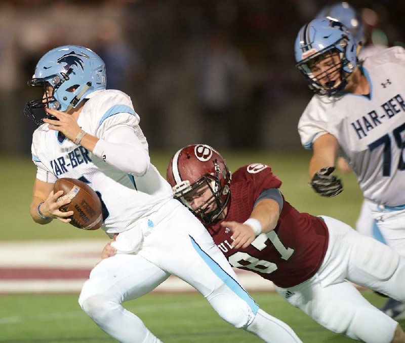 NWA Democrat-Gazette/ANDY SHUPE
Har-Ber quarterback Grant Allen (left) slips past Springdale defensive end Jayce Carry (87) Thursday, Sept. 28, 2017, during the first half at Jarrell Williams Bulldog Stadium. Visit nwadg.com/photos to see more photographs from the game.