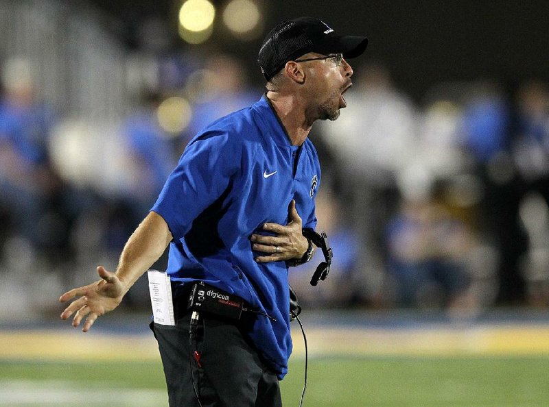 Arkansas Democrat-Gazette/THOMAS METTHE -- 9/29/2017--
Conway head coach Clint Ashcraft yells to his players during the third quarter of North Little Rock's 24-14 win on Friday, Sept. 29, 2017, in North Little Rock.