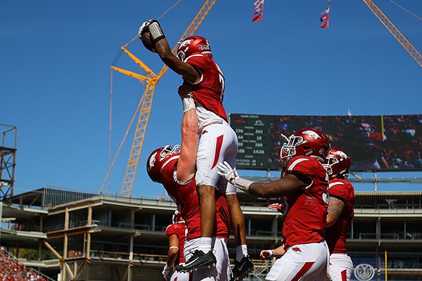 Arkansas receiver Jonathan Nance is lifted up after scoring a touchdown during the third quarter of a game against New Mexico State on Saturday, Sept. 30, 2017, in Fayetteville. 