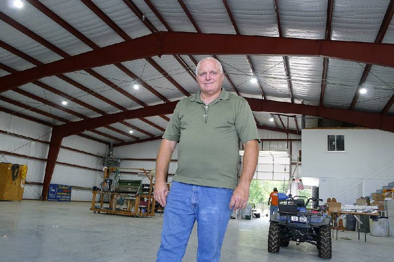 Fred Ogden, manager of Mena’s airport, stands inside the 8,000-square-foot hangar where Barry Seal supposedly had his plane modified. Ogden said conspiracy tourists used to visit the hangar and that “They would say, ‘You mean this is it?’” He said Seal’s plane was probably too big for the hangar, anyway. 