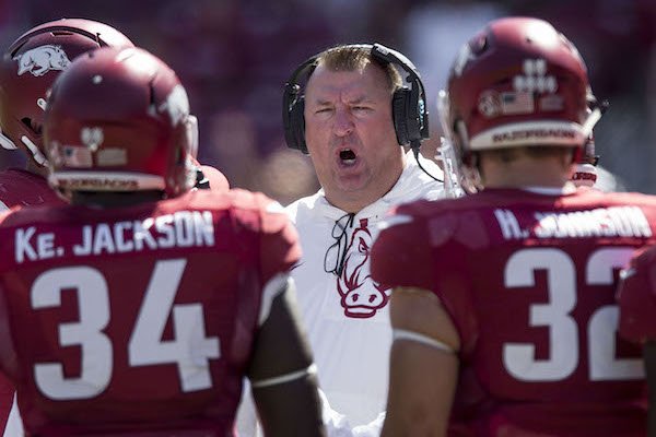 Bret Bielema, Arkansas head coach, talks to offensive players in the fourth quarter against New Mexico State Saturday, Sept. 30, 2017, at Razorback Stadium in Fayetteville. 