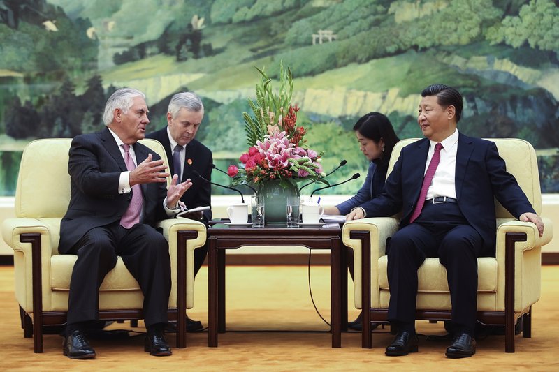 U.S. Secretary of State Rex Tillerson, left, meets with China's President Xi Jinping at the Great Hall of the People, Saturday, Sept. 30, 2017, in Beijing. (Lintao Zhang/Pool Photo via AP)