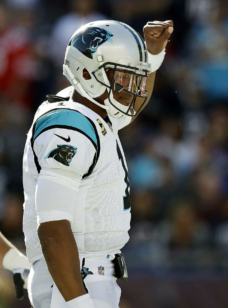 Carolina Panthers quarterback Cam Newton celebrates his touchdown run during Sunday’s game against the New England Patriots in Foxborough, Mass.