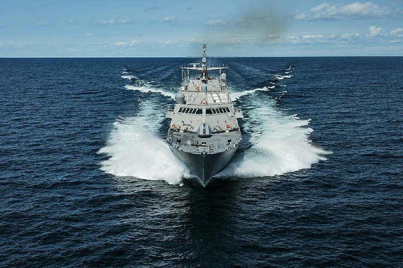 The ship that will be commissioned later this year as the USS Little Rock cuts through Lake Michigan during sea trials in August. 