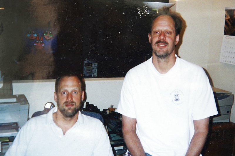 This undated photo provided by Eric Paddock shows him at left with his brother, Las Vegas gunman Stephen Paddock at right.