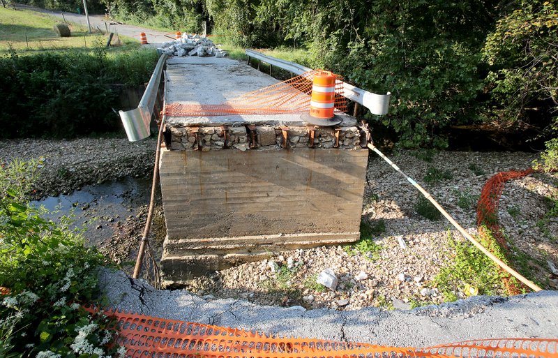 NWA Democrat-Gazette/DAVID GOTTSCHALK The bridge over Spring Creek on Pump Station Road Friday, September 1, 2017, in Springdale was irreparably damaged by the April and May Floods. The road is currently closed and blocked off from traffic.
