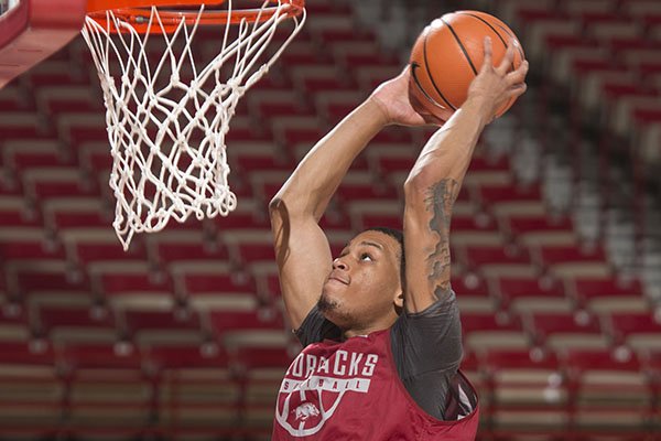 Arkansas guard Khalil Garland dunks the ball during practice Tuesday, Oct. 3, 2017, in Fayetteville. 