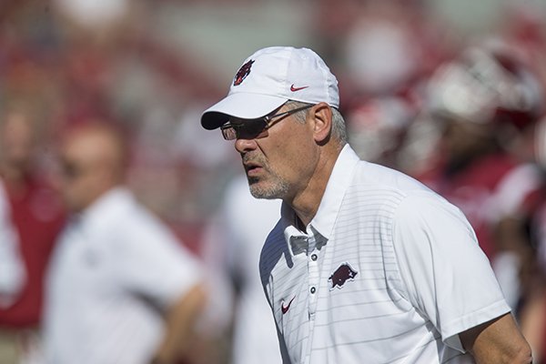 Arkansas defensive coordinator Paul Rhoads watches warmups prior to a game against New Mexico State on Saturday, Sept. 30, 2017, in Fayetteville. 