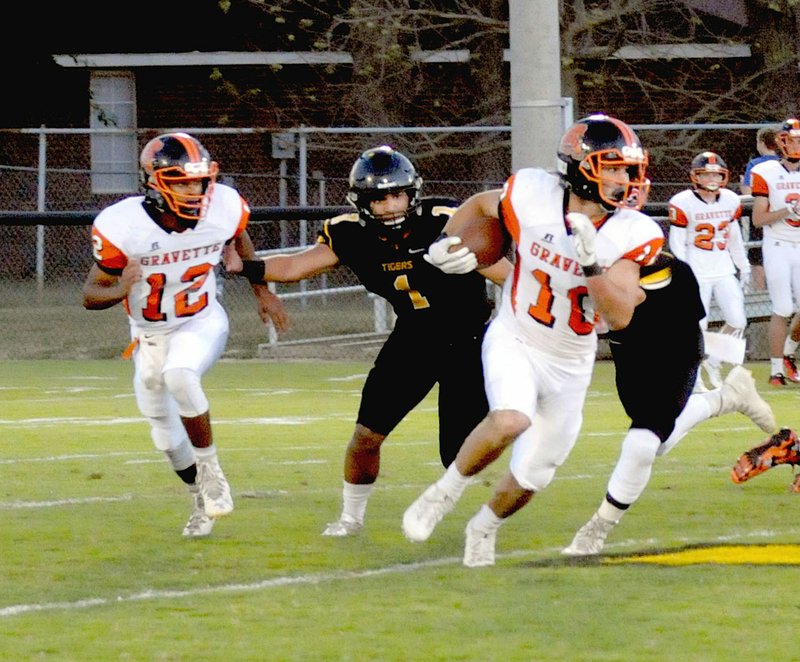 MARK HUMPHREY ENTERPRISE-LEADER/Gravette runningback Austin O&#8217;Brien carries the ball against Prairie Grove. O&#8217;Brien ran 28 times for 210 yards and a touchdown in the Lions&#8217; 31-7 loss to the Tigers Friday.