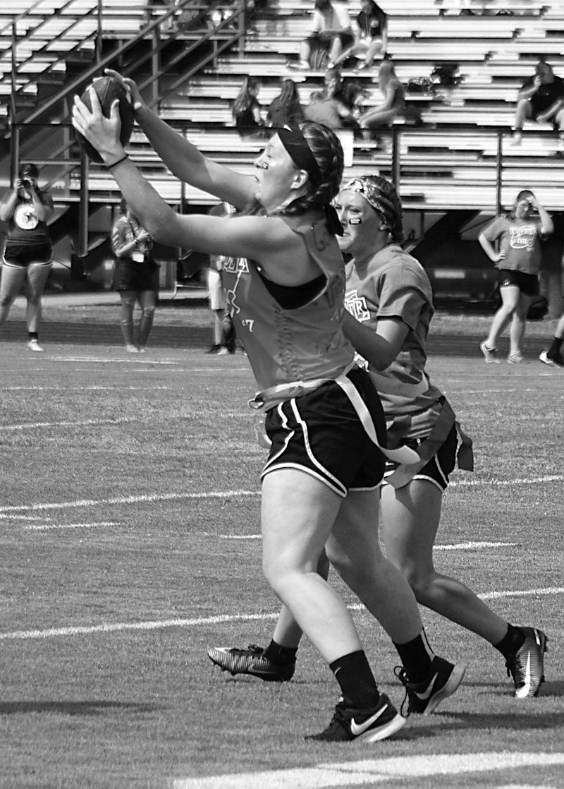 Gentry sophomore Carissa Goessens, with junior Cali Stevens defending, catches a pass during play between the two class teams on Thursday.