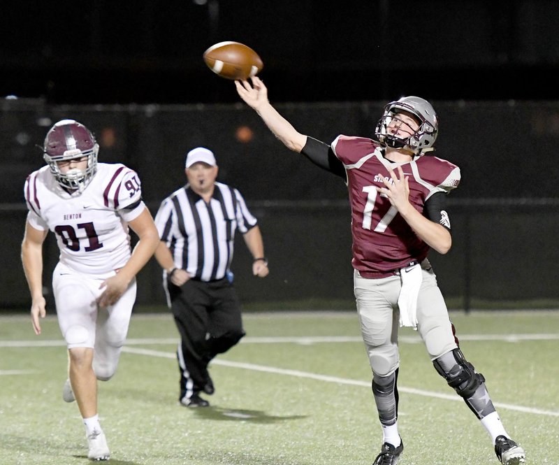 Bud Sullins/Special to the Herald-Leader Siloam Springs junior quarterback Landon Ellis throws a pass against Benton as defensive lineman Ty Neathery gives chase in the first half last week. Ellis and the Panthers visit No. 1 Greenwood on Friday.