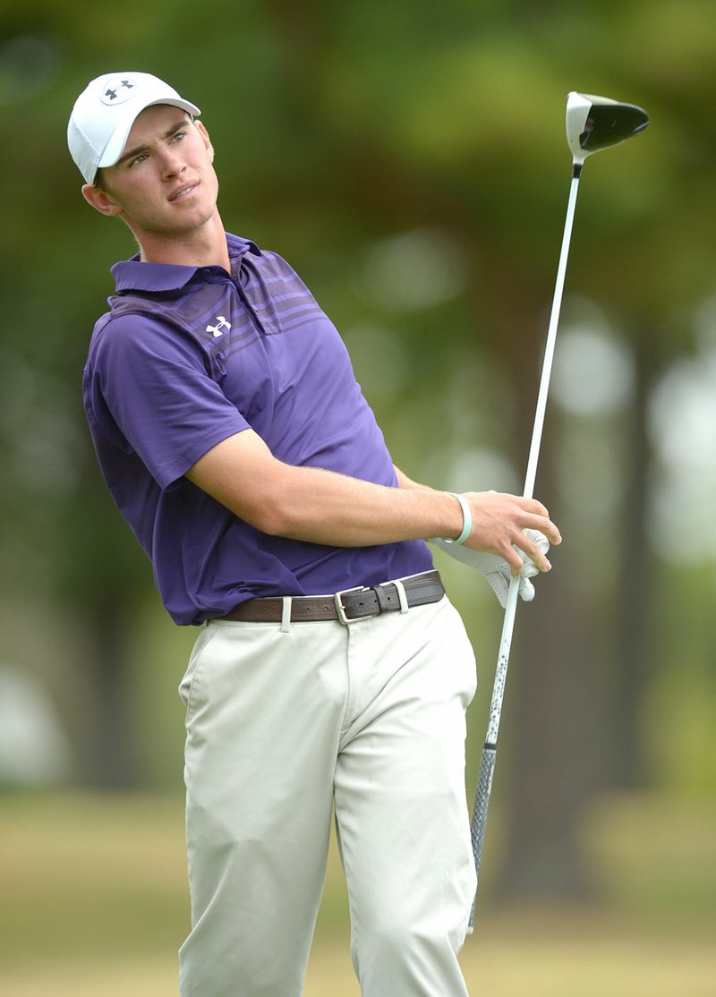 NWA Democrat-Gazette/ANDY SHUPE Fisher Vollendorf of Fayetteville watches his shot from the No. 6 tee box Tuesday during the 7A state golf tournament at Fayetteville Country Club. Visit nwadg.com/photos for more photos from the first day of competition.