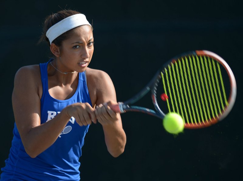 NWA Democrat-Gazette/ANDY SHUPE Rogers junior Erica Jaggernauth returns a shot Thursday, Sept. 14, 2017, during a match with Fayetteville in Fayetteville. Jaggernauth moved to Rogers from Bixby, Okla., and is one of the top singles players in the state. She is also currently unbeaten in singles competition this season.