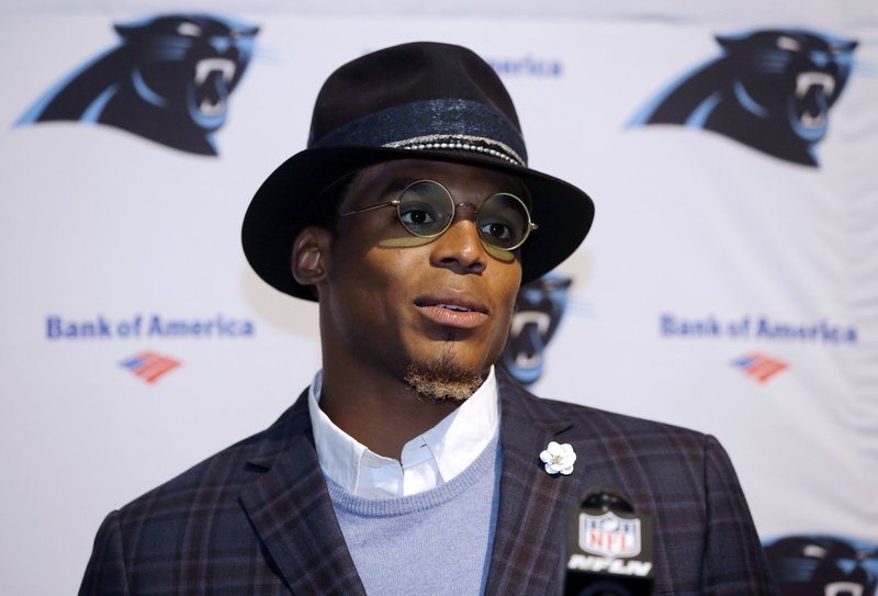 FILE - In this Oct. 1, 2017, file photo, Carolina Panthers quarterback Cam Newton speaks to the media following an NFL football game against the Carolina Panthers, in Foxborough, Mass. Dannon, the maker of Oikos yogurt, is cutting ties with spokesman Cam Newton following what the company perceives as “sexist” comments the Carolina quarterback made to a female reporter. (AP Photo/Steven Senne, File)
