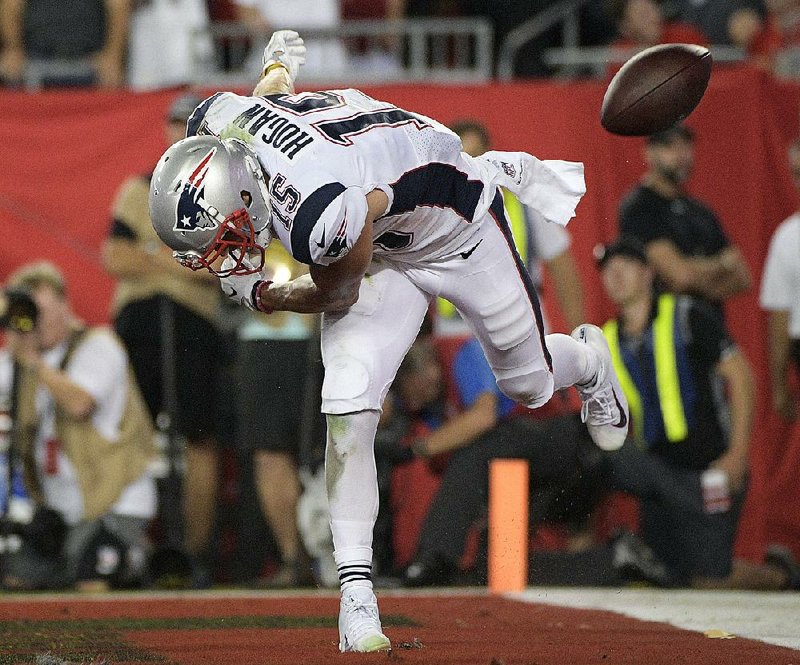 New England wide receiver Chris Hogan spikes the ball after scoring a second-quarter touchdown Thursday during the Patriots’ 19-14 victory over the Tampa Bay Buccaneers at Raymond James Stadium in Tampa, Fla.