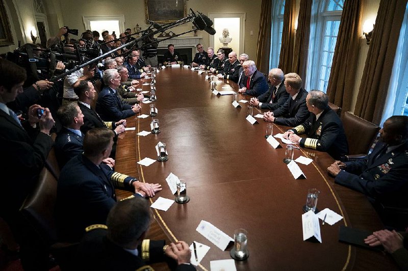 President Donald Trump meets with senior military leaders Thursday in the Cabinet Room at the White House. Trump and senior security advisers have agreed to “decertify” the nuclear agreement with Iran, sources said Thursday, the first step toward possible renewed sanctions.