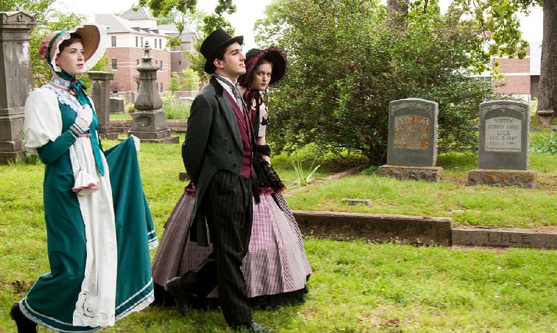 Tales of the Crypt actors (from left) Emorie Mansur, Peyton Hooks and Rahlea Zinck stroll through Mount Holly Cemetery before a 2016 benefit.