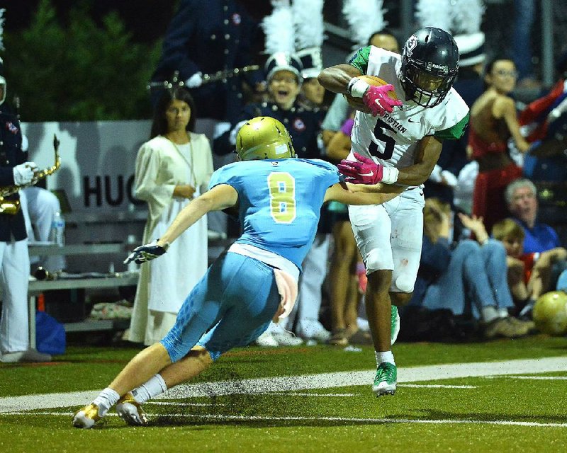 Little Rock Christian wide receiver Justice Hill jukes Pulaski Academy defender Luke Bratcher (8) during Friday night's game against at Joe B. Hatcher stadium in Little Rock.

Special to the Democrat-Gazette/JIMMY JONES