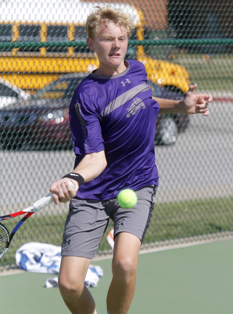 Fayetteville’s Jake Sweeney makes a forehand return Friday during the 7A-West tennis tournament final against Springdale Har-Ber’s Conor Clardy in Springdale.