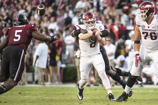 South Carolina defensive lineman Dante Sawyer (95) forces a fumble against Arkansas quarterback Austin Allen (8) during the second half of an NCAA college football game Saturday, Oct. 7, 2017, in Columbia, S.C. (AP Photo/Sean Rayford)