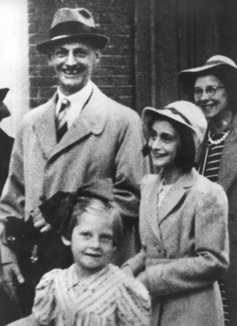 Otto Frank and his daughter, Anne, beside him, stand outside Amsterdam’s Town Hall with two unidentified people in July 1941 before their family was forced to hide from Nazi occupiers. 