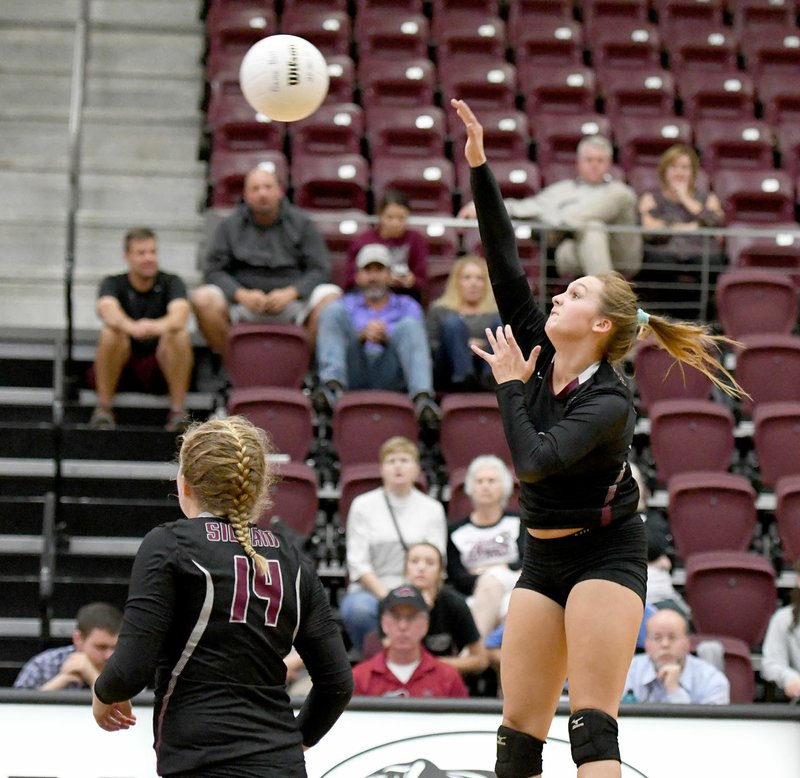 Bud Sullins/Special to Siloam Sunday Siloam Springs junior Katie Kendrick hits the ball Tuesday against Alma as junior Annabelle Van Asche looks on. Siloam Springs swept Alma and then went on the road and swept Russellville on Thursday.