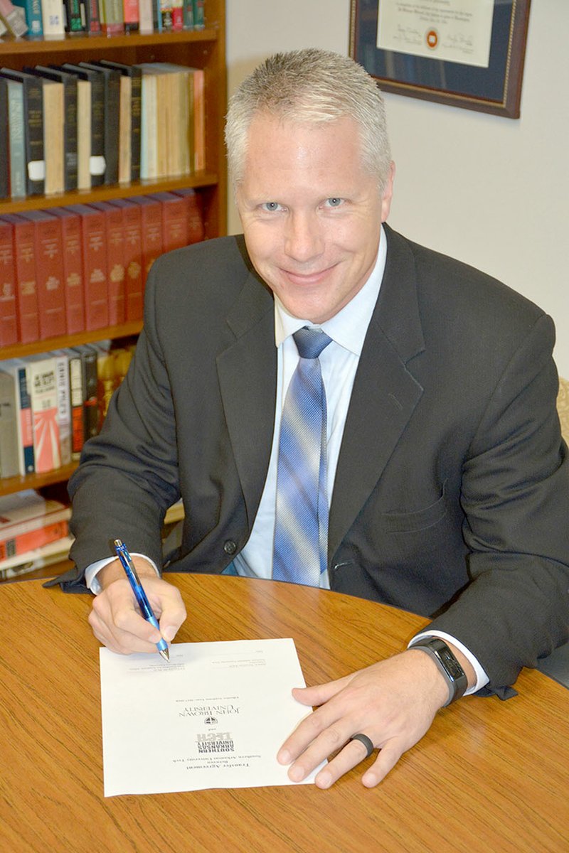 Photo submitted Dr. Ed Ericson, JBU&#x2019;s vice president for academic affairs, signed an articulation agreement, which gives students the opportunity to continue their educational careers by transferring courses from SAU Tech to JBU.