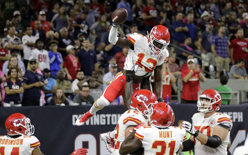 Kansas City Chiefs wide receiver De'Anthony Thomas (13) celebrates his touchdown with teammates during the second half of an NFL football game against the Houston Texans, Sunday, Oct. 8, 2017, in Houston. 