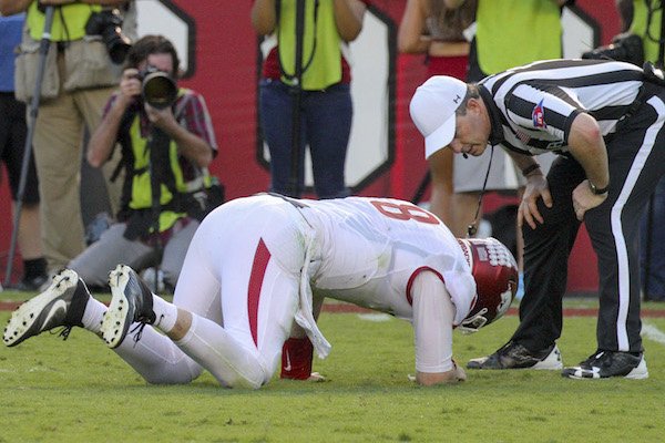 Arkansas quarterback Austin Allen (8) takes a while to get up after being hit by South Carolina Skai Moore during the third quarter of the Razorbacks loss in South Carolina. Allen did not return for the rest of the game after the play. 