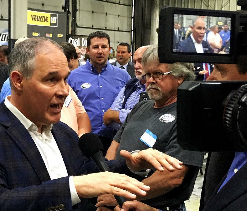 EPA Administrator Scott Pruitt talks to a reporter after speaking at Whayne Supply on Monday in Hazard, Ky.