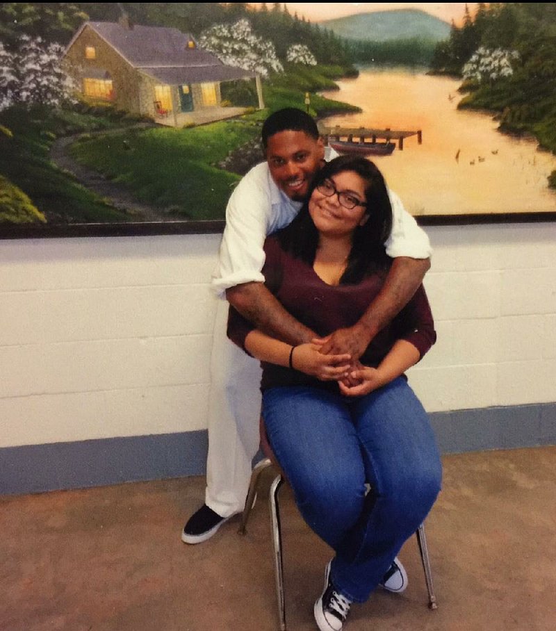 Wayne Young and Claudia Cerna hug during a visitation. The two met when Young was already in prison and plan to get married before the end of this year.