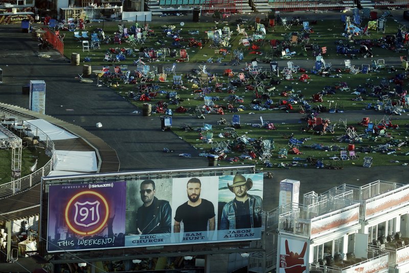 In this Tuesday, Oct. 3, 2017, file photo, personal belongings and debris litters the Route 91 Harvest festival grounds across the street from the Mandalay Bay resort and casino in Las Vegas. On Sunday, Oct. 1, 2017, gunman Stephen Paddock carried out the deadliest mass shooting in modern U.S. history, leaving Americans try to come to terms with yet another mass murder. 