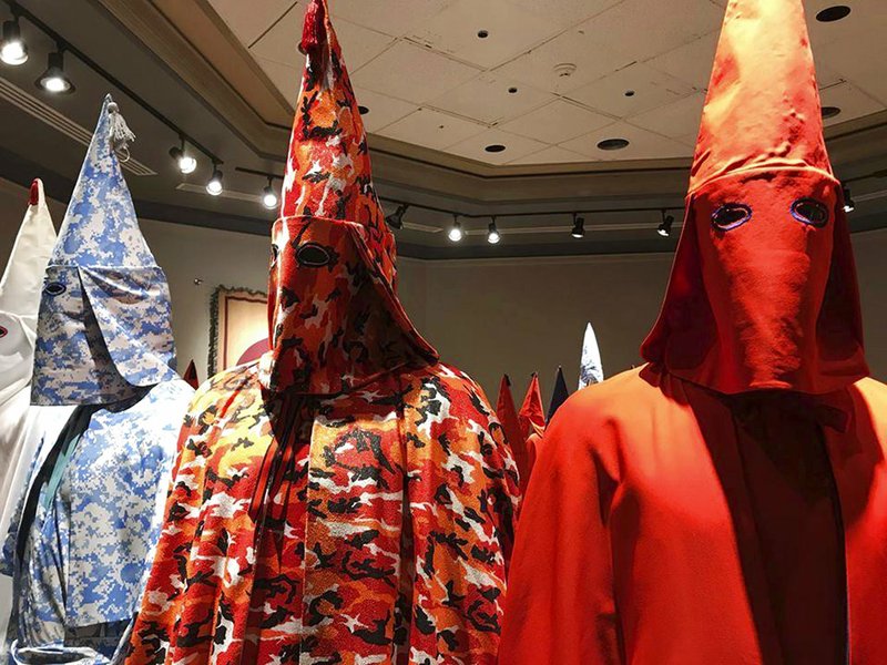 n this Sept. 21, 2017 photo, KKK robes are on display as part of Baltimore artist Paul Rucker's installation entitled "Rewind," now installed at York College's Wolf Hall in York, Pa. 