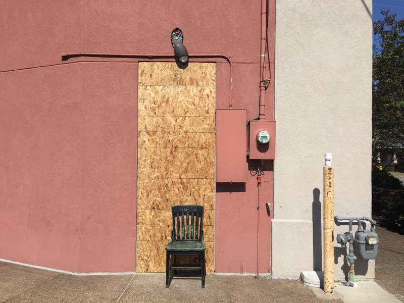 The back door of Damgoode Pies at 2701 Kavanaugh Blvd. in Little Rock is boarded up Tuesday after a break-in Monday.