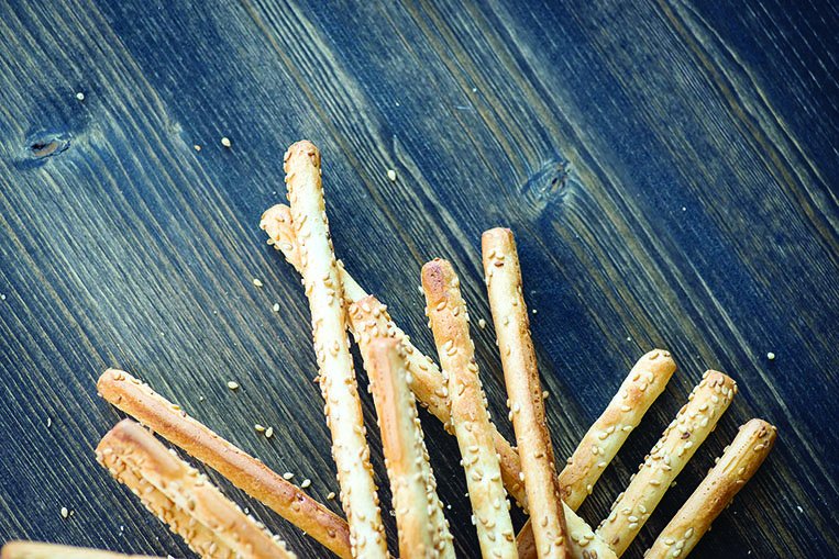 Aside from Parmesan, roll the breadsticks in sesame seeds for a different flavor.