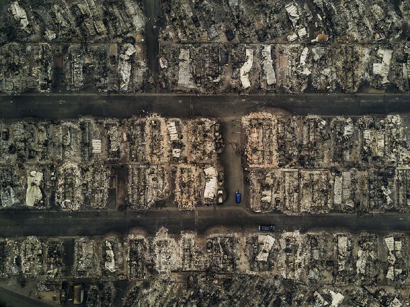 Little is left of homes in the Journey’s End Mobile Home Park in Santa Rosa, Calif., on Tuesday after a wildfire raced through the area early Monday. 