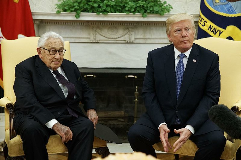 President Donald Trump, during a meeting on foreign policy Tuesday at the White House with former Secretary of State Henry Kissinger, disputed the idea that he had undercut his own secretary of state through comments in an interview with Forbes magazine. 