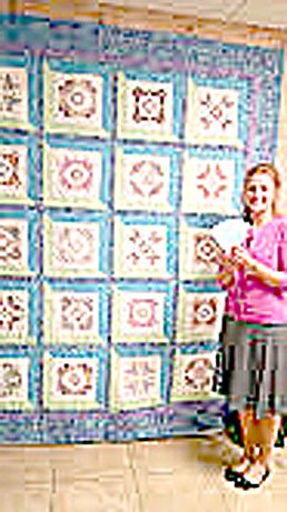 Photo submitted Rebecca Keener, who purchased tickets at Bella Vista Beauty Shop for the quilt being raffled by the Bella Vista Decorative Artists, is shown with the quilt.
