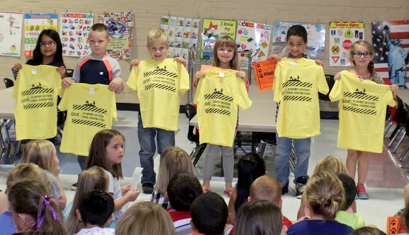 Submitted Photo PAWS ("Pawsitive" and Wise Students) winners at Glenn Duffy Elementary School were honored at the school's monthly Rise and Shine assembly Monday, Oct. 2. PAWS award winners for the month of October, pictured here displaying the T-shirts they received, are Bella Forest (left), kindergarten; Jack Cantrell, kindergarten; Wyatt Clayton, first grade; Paden Lemonds, first grade; Rhett Curtis, second grade; and Erynn McGee, second grade.